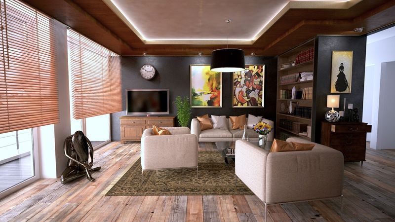 Fully furnished living room with armchairs and a rug in place